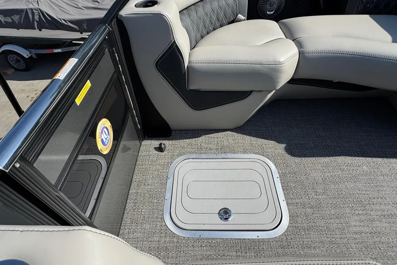 Slide: The Image of 2026 Barletta Lusso 23UC boat interior with gray seating and carpeted flooring. - 147