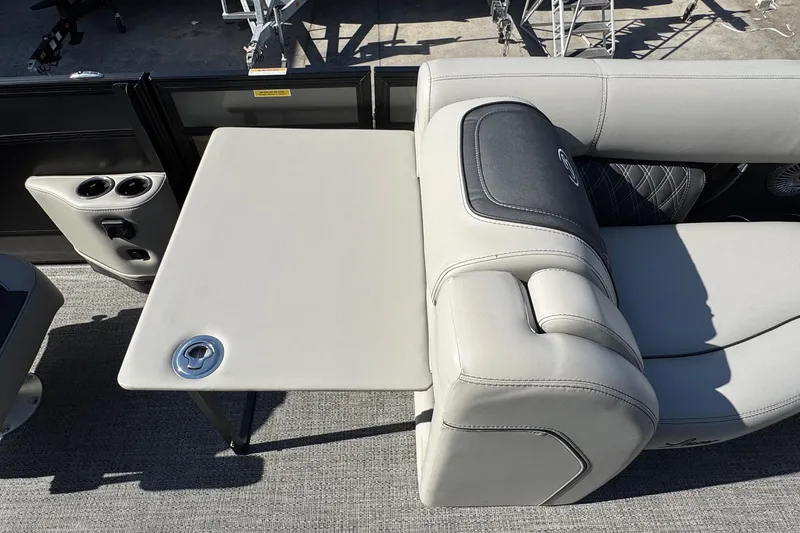 Slide: The Image of Luxurious seating and table setup on 2026 Barletta Lusso 23UC pontoon boat. - 152