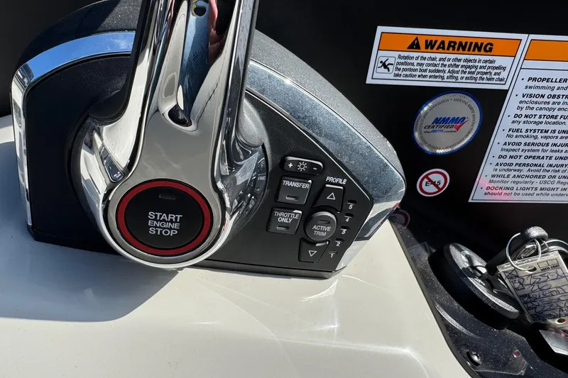 Slide: The Image of Control panel of 2026 Barletta Lusso 23UC boat with start engine button and warning labels. - 161
