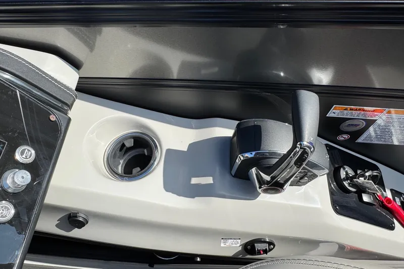 Slide: The Image of Control panel of 2026 Barletta Lusso 23UC boat with throttle and cup holder. - 162