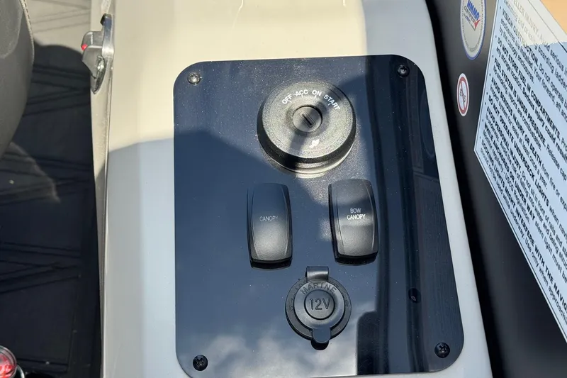 Slide: The Image of Control panel of 2026 Barletta Lusso 23UC with switches and 12V outlet. - 163