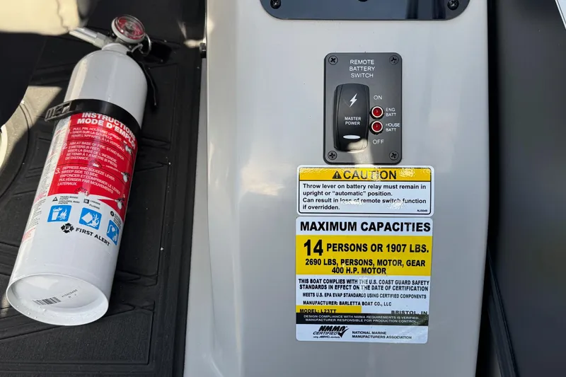 Slide: The Image of 2026 Barletta Lusso 23UC boat capacity label and fire extinguisher, highlighting safety features. - 164