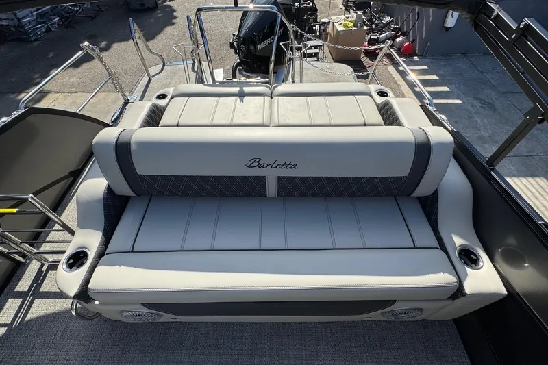 Slide: The Image of 2026 Barletta Lusso 23UC boat interior with luxurious seating and cup holders. - 165
