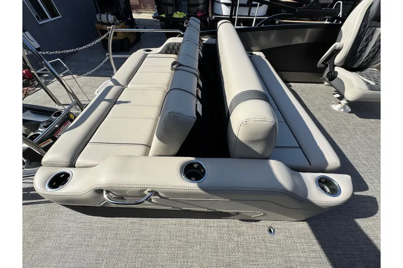 Slide: The Image of 2026 Barletta Lusso 23UC boat interior with luxurious seating and cup holders. - 171