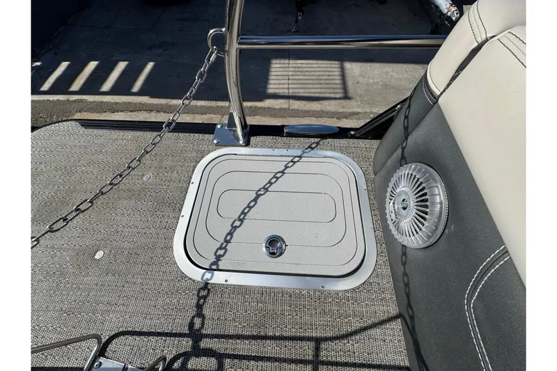 Slide: The Image of 2026 Barletta Lusso 23UC boat deck with hatch and speaker detail. - 172