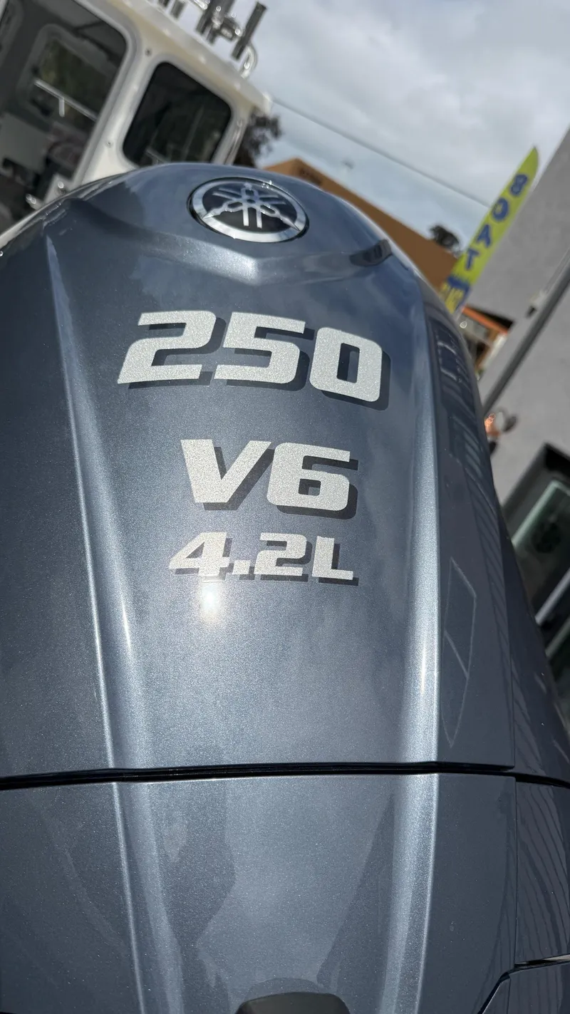 Slide: The Image of Outboard motor with "250 V6 4.2L" label on a 2025 Defiance Admiral 220 EX boat. - 15