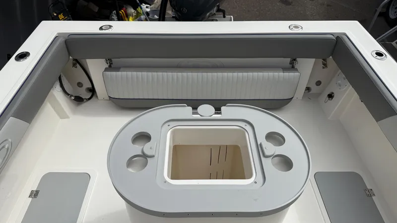 Slide: The Image of 2025 Defiance Admiral 220 EX boat interior with seating and storage compartments. - 16