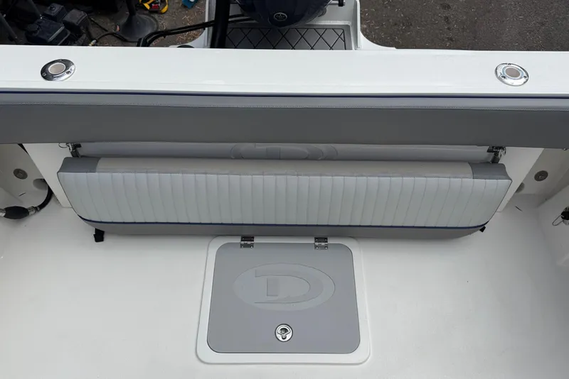 Slide: The Image of 2025 Defiance Admiral 220 EX boat interior with foldable seat and storage compartment. - 28