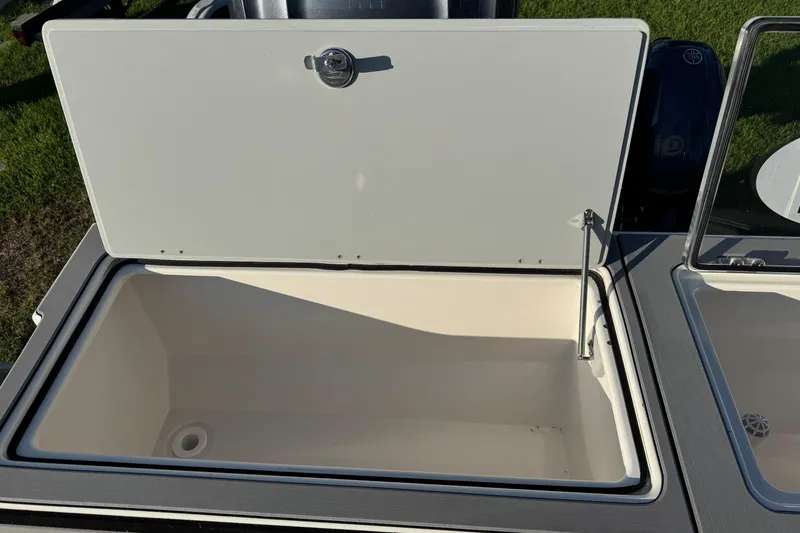 Slide: The Image of Open storage compartment on 2025 Defiance Admiral 250 EX boat. - 35