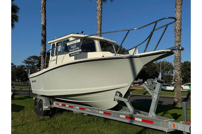 Slide: The Image of 2025 Defiance Admiral 250 EX boat on trailer, displayed outdoors. - 4