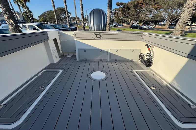 Slide: The Image of 2025 Defiance Admiral 250 EX boat deck with sleek, modern design and spacious layout. - 45