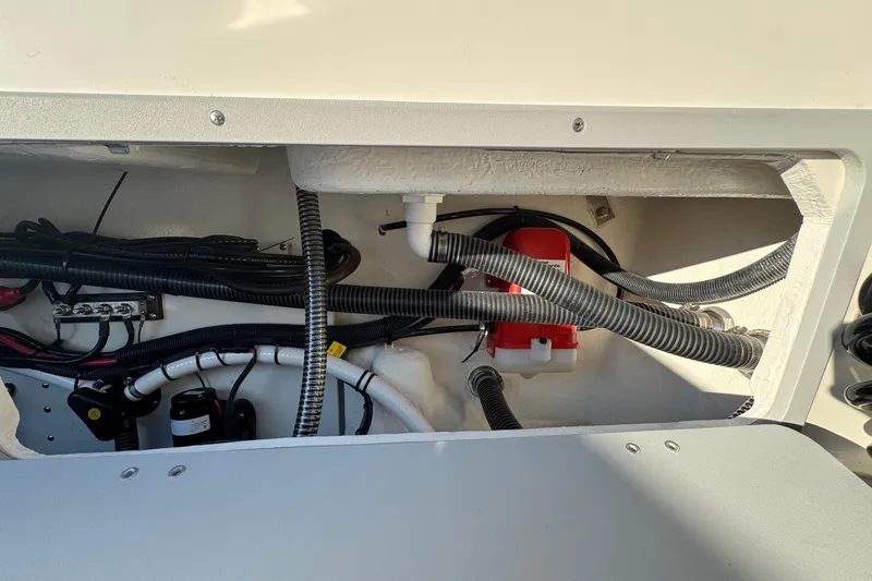 Slide: The Image of Engine compartment of 2025 Defiance Admiral 250 EX boat, showcasing wiring and components. - 51