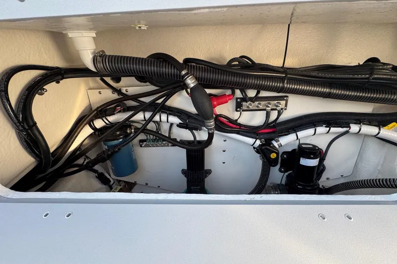 Slide: The Image of 2025 Defiance Admiral 250 EX engine compartment with wiring and components. - 52