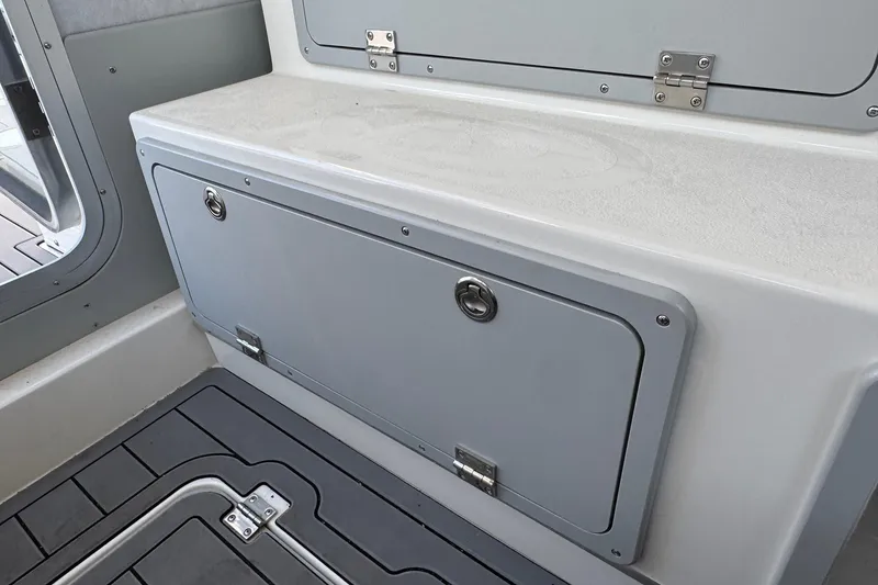 Slide: The Image of Interior storage compartment of 2025 Defiance Admiral 250 EX boat. - 61