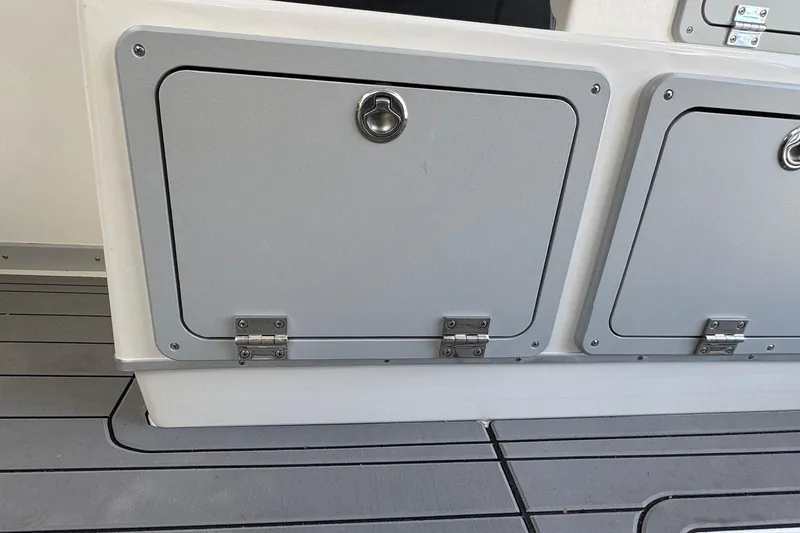 Slide: The Image of Storage compartments on 2025 Defiance Admiral 250 EX boat deck. - 71