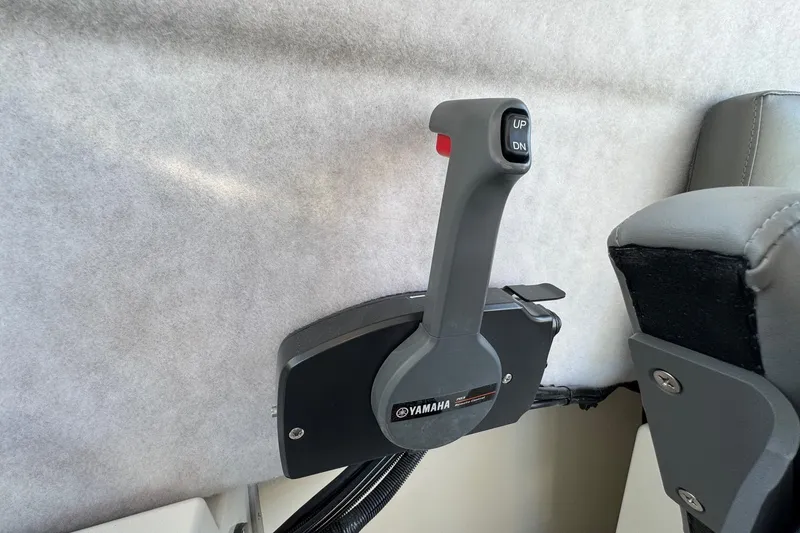 Slide: The Image of Yamaha throttle control in 2025 Defiance Admiral 250 EX boat interior. - 78