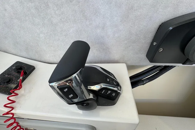 Slide: The Image of Throttle control of 2025 Defiance Admiral 250 EX boat, featuring up and down buttons. - 79