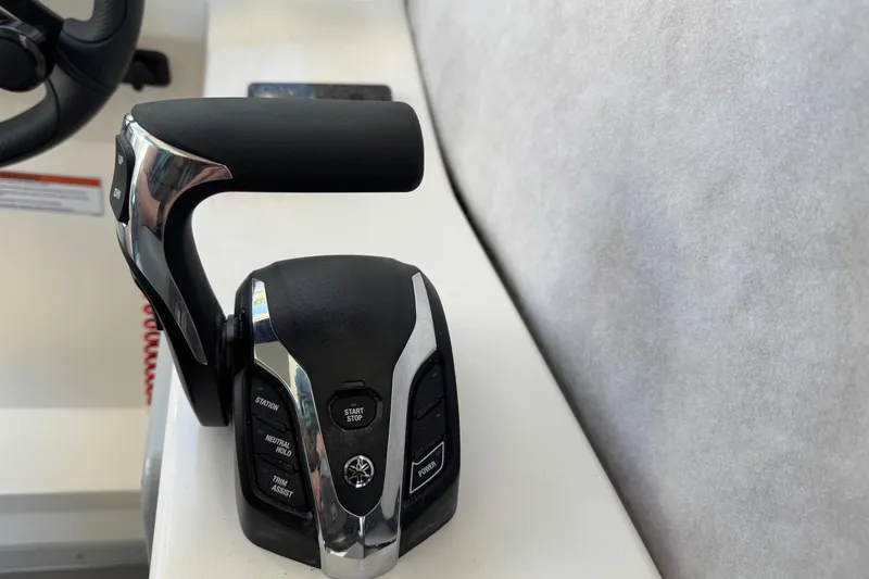 Slide: The Image of Throttle control of 2025 Defiance Admiral 250 EX boat, featuring ergonomic design and controls. - 80