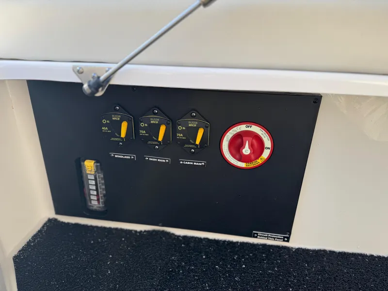 Slide: The Image of Control panel of 2025 Regal 26 XO boat with switches and battery selector. - 38