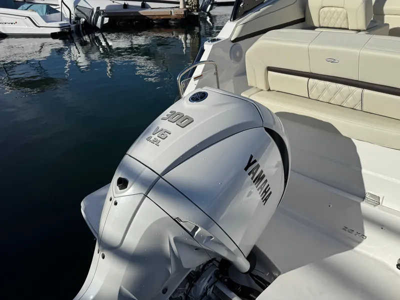 Slide: The Image of 2025 Regal 26 XO boat with Yamaha 300 V6 engine at a marina. - 8