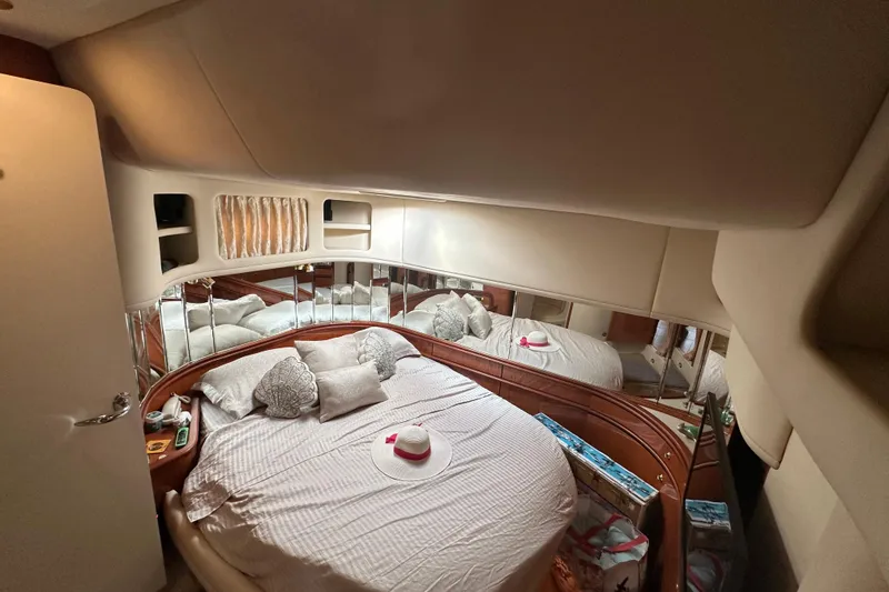 Slide: The Image of Luxurious bedroom interior of 2001 Sea Ray 540 Sundancer yacht with elegant bedding. - 10