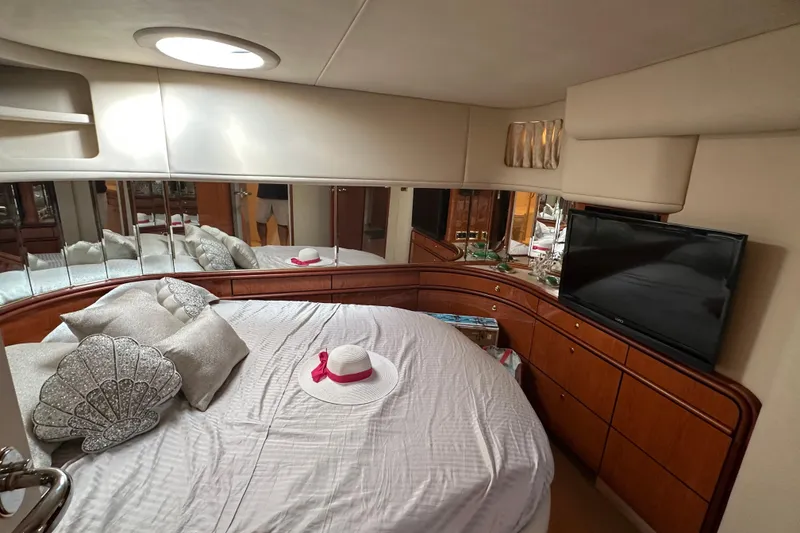 Slide: The Image of Luxurious bedroom interior of 2001 Sea Ray 540 Sundancer yacht with elegant decor. - 11