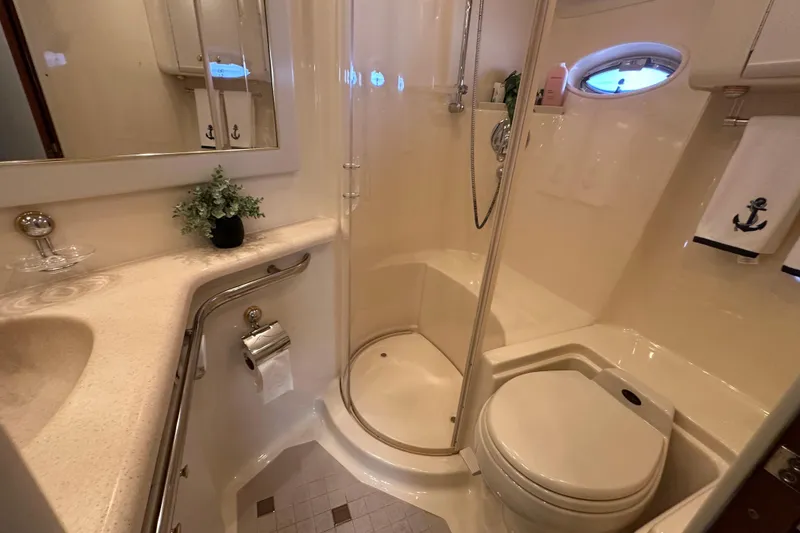 Slide: The Image of Luxurious bathroom in 2001 Sea Ray 540 Sundancer yacht with shower and toilet. - 14