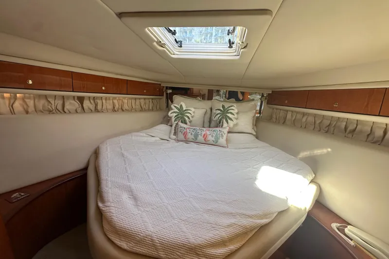 Slide: The Image of Luxurious cabin interior of 2001 Sea Ray 540 Sundancer yacht with cozy bedding. - 19