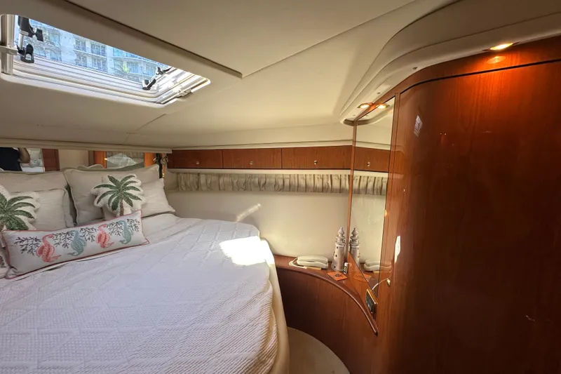 Slide: The Image of Luxurious 2001 Sea Ray 540 Sundancer cabin with elegant wood finish and nautical decor. - 21