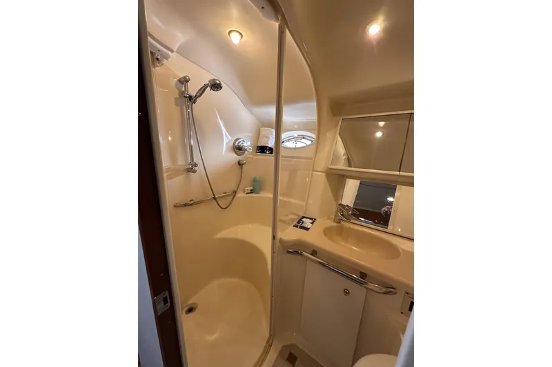 Slide: The Image of Bathroom interior of 2001 Sea Ray 540 Sundancer yacht, featuring shower and sink. - 25