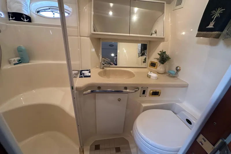 Slide: The Image of Bathroom interior of 2001 Sea Ray 540 Sundancer yacht, featuring sink and toilet. - 26