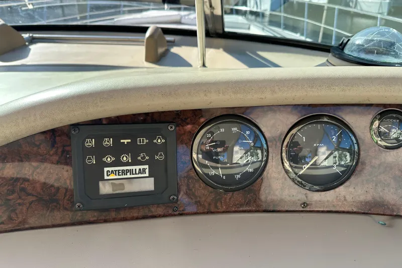 Slide: The Image of Dashboard of a 2001 Sea Ray 540 Sundancer with Caterpillar engine panel and gauges. - 29