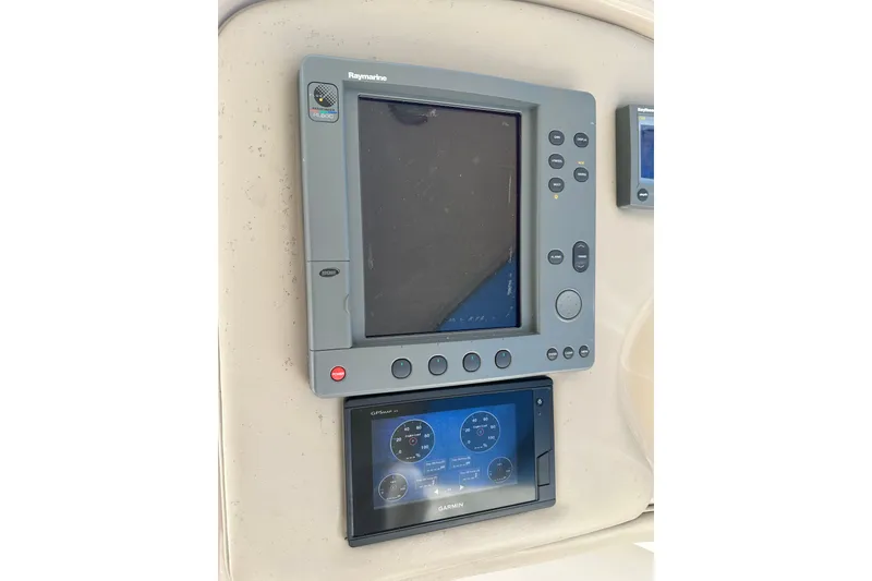 Slide: The Image of Raymarine and Garmin navigation displays on 2001 Sea Ray 540 Sundancer yacht. - 32