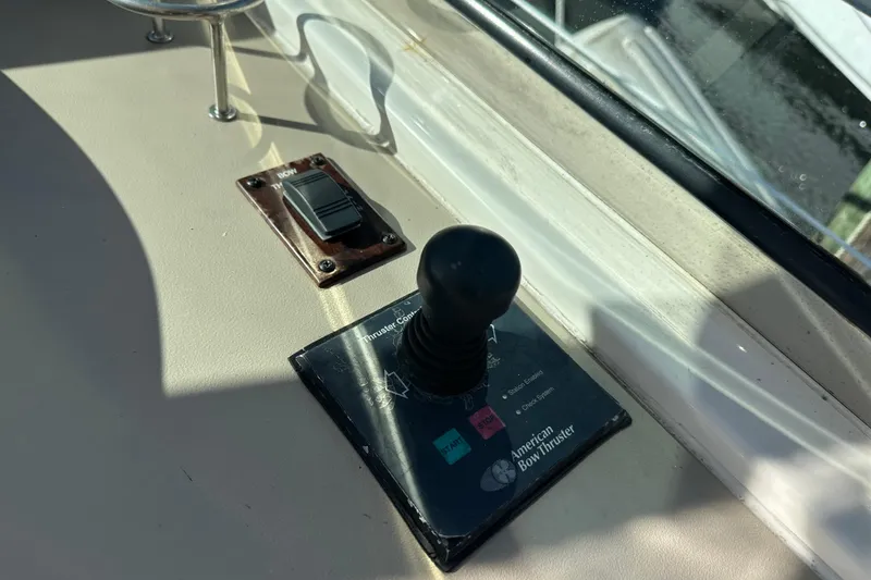 Slide: The Image of Control panel of a 2001 Sea Ray 540 Sundancer boat with joystick and switch. - 35