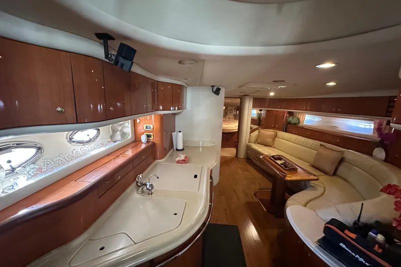 Slide: The Image of Luxurious interior of a 2001 Sea Ray 540 Sundancer yacht with elegant wood finishes. - 4