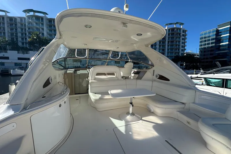 Slide: The Image of Luxurious 2001 Sea Ray 540 Sundancer yacht interior with white seating and table. - 42