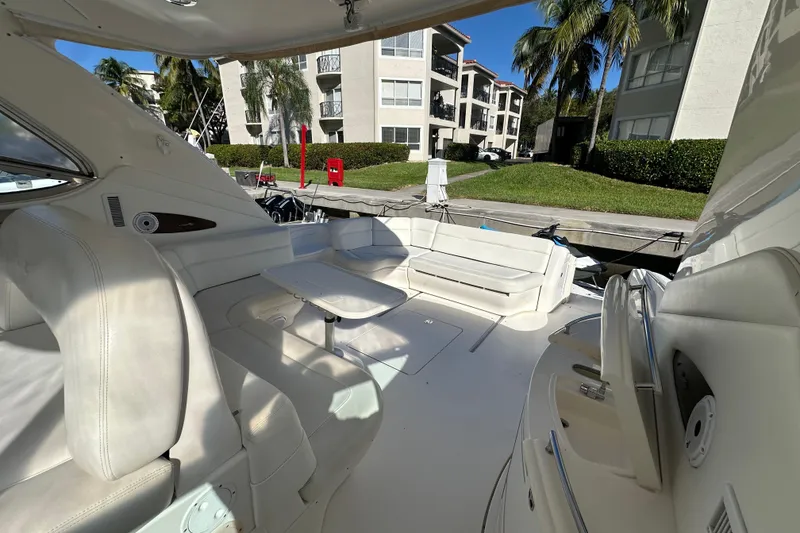 Slide: The Image of Luxurious 2001 Sea Ray 540 Sundancer yacht interior with white seating and table. - 44