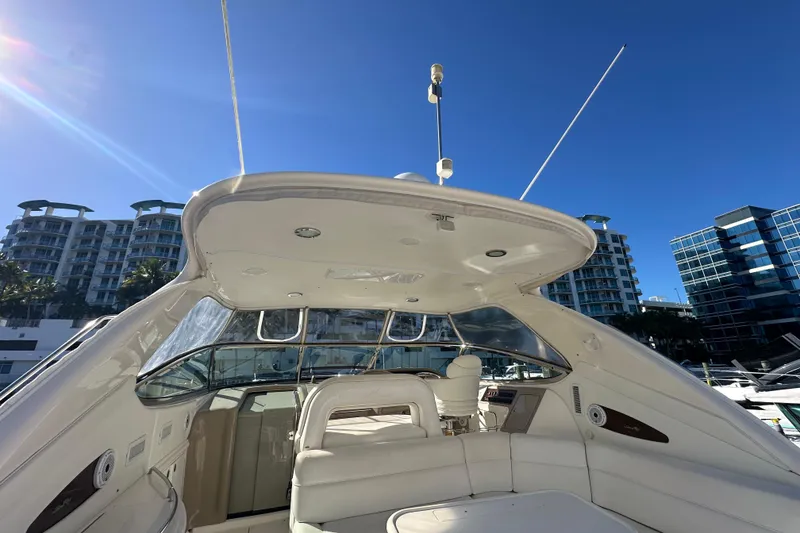 Slide: The Image of 2001 Sea Ray 540 Sundancer yacht interior with modern design, docked near urban buildings. - 46