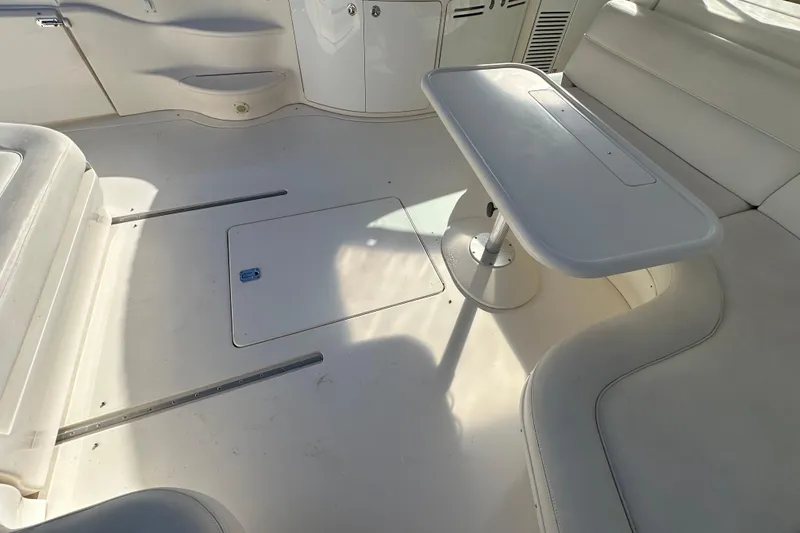 Slide: The Image of 2001 Sea Ray 540 Sundancer interior with seating and table in white. - 48