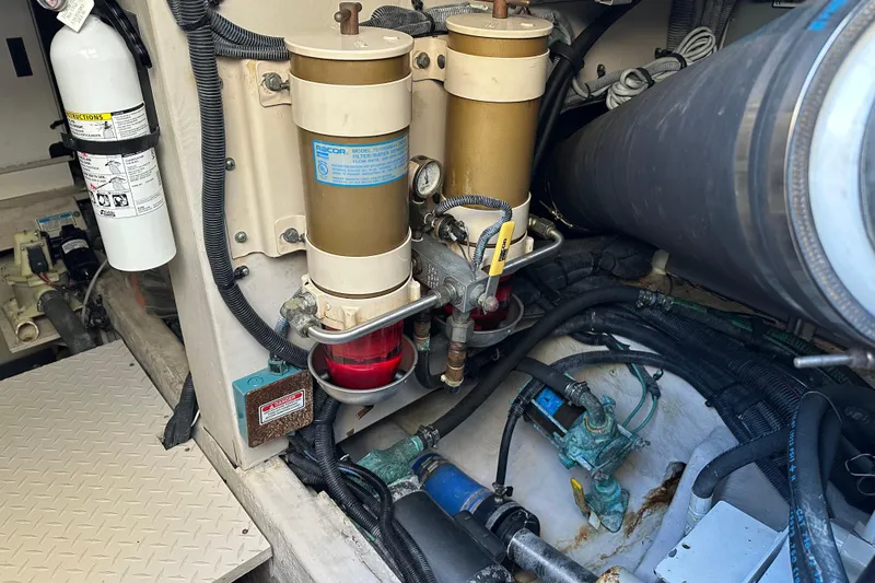 Slide: The Image of Engine room of 2001 Sea Ray 540 Sundancer with fuel filters and fire extinguisher. - 50