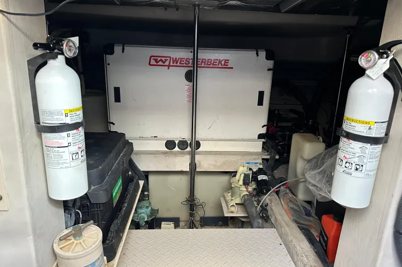 Slide: The Image of Engine room of 2001 Sea Ray 540 Sundancer with Westerbeke generator and fire extinguishers. - 51