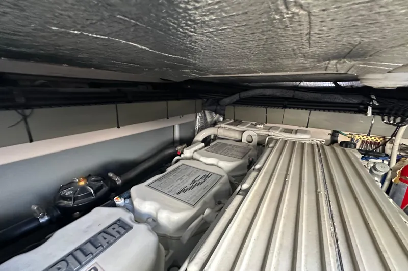 Slide: The Image of Engine room of 2001 Sea Ray 540 Sundancer with visible components and wiring. - 56