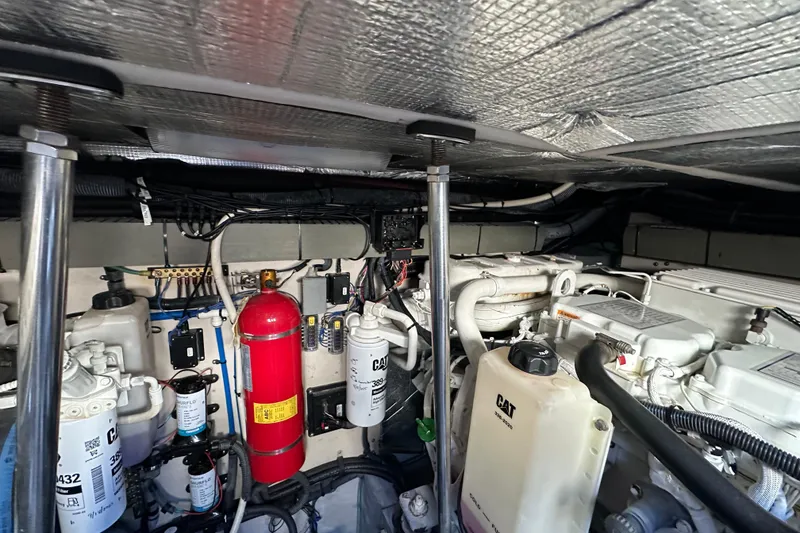 Slide: The Image of Engine room of 2001 Sea Ray 540 Sundancer with CAT components and fire extinguisher. - 58