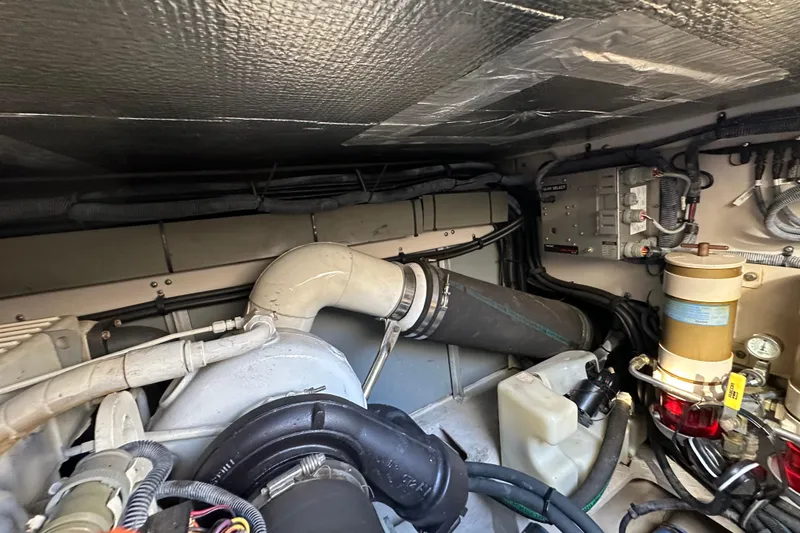 Slide: The Image of Engine room of 2001 Sea Ray 540 Sundancer with visible components and wiring. - 61