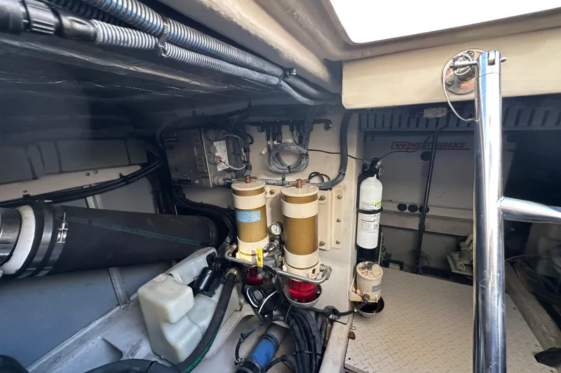 Slide: The Image of Engine room of 2001 Sea Ray 540 Sundancer with visible components and equipment. - 62