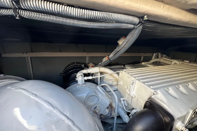 Slide: The Image of Engine compartment of a 2001 Sea Ray 540 Sundancer yacht, showcasing mechanical components. - 64