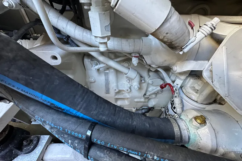 Slide: The Image of Engine compartment of a 2001 Sea Ray 540 Sundancer with visible hoses and components. - 66