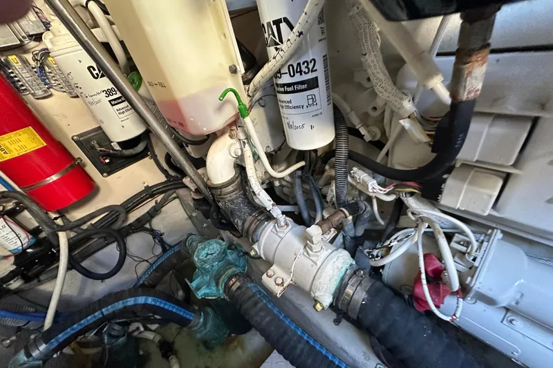 Slide: The Image of Engine room of 2001 Sea Ray 540 Sundancer with fuel filters and hoses. - 68