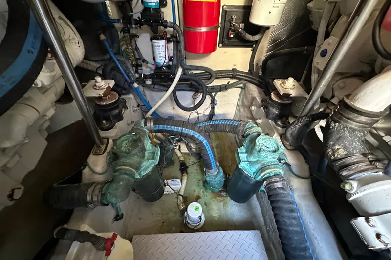 Slide: The Image of Engine room of 2001 Sea Ray 540 Sundancer with visible hoses and components. - 69