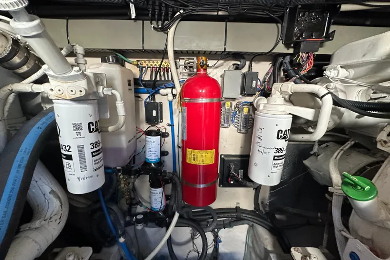 Slide: The Image of Engine room of 2001 Sea Ray 540 Sundancer with filters and fire extinguisher. - 70